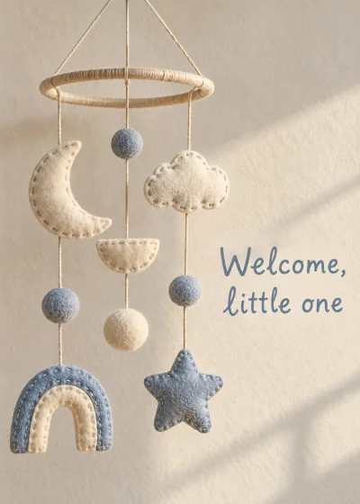 A hand-sewn fabric mobile. Welcome, little one.