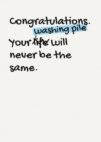 Marker lettering. Congratulations. Your washing pile will never be the same. "life" is crossed out and "washing pile" written above it.